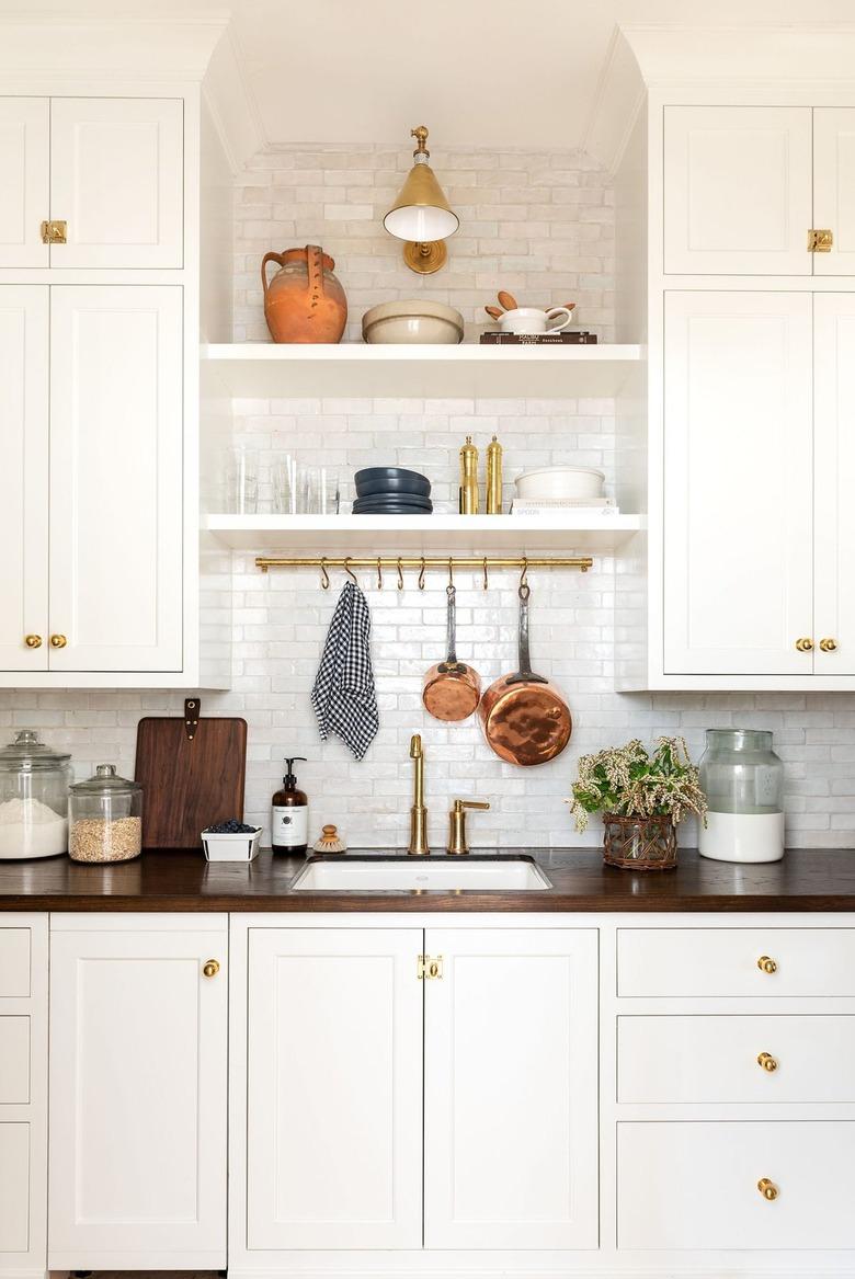 Farmhouse style pantry with white backsplash by Studio McGee