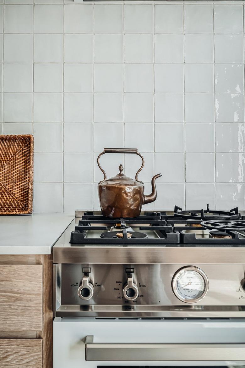 Farmhouse kitchen with square white tile backsplash