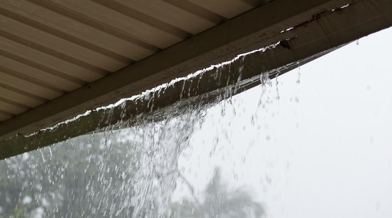 Broken Gutter with rain pouring through