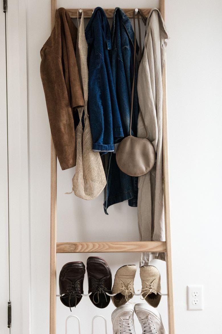 ladder used as shoe storage in entryway