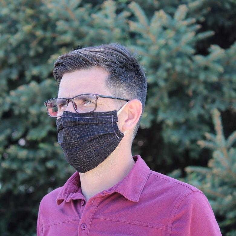 person wearing face mask and glasses