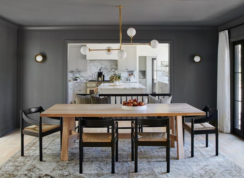 dining room with dark grey walls