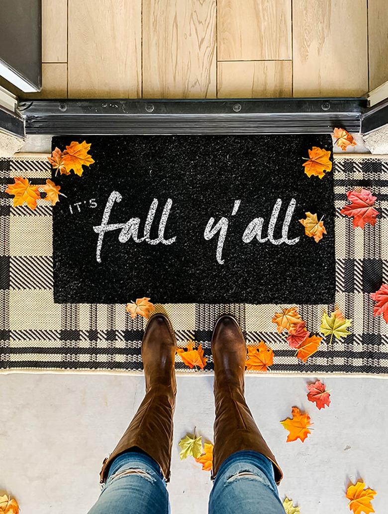 It's Fall Y'all fall doormat in black and white with plaid rug