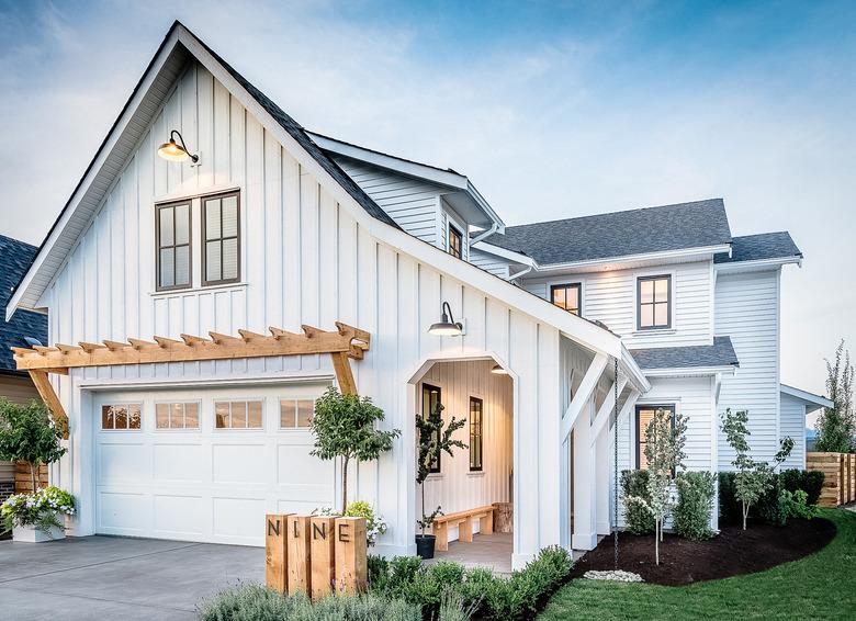 Farmhouse garage door in white with wood pergola