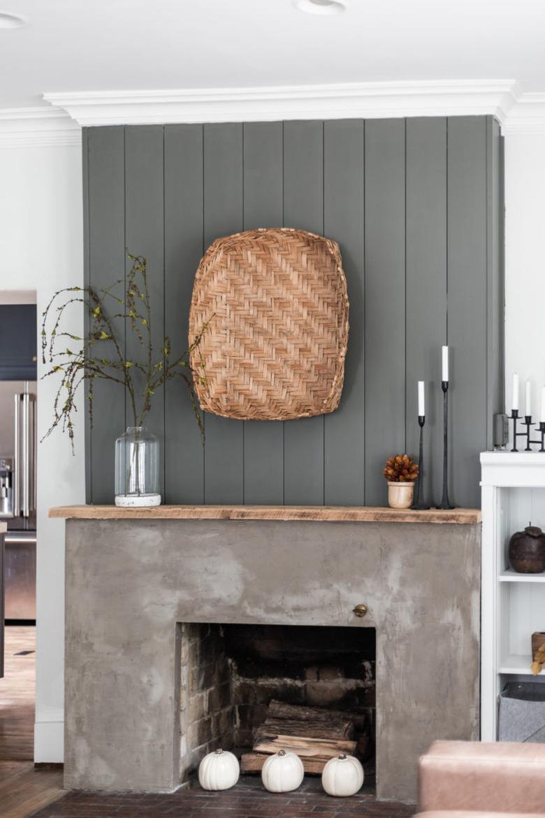 rustic minimalist farmhouse mantel decorating idea with concrete fireplace surround