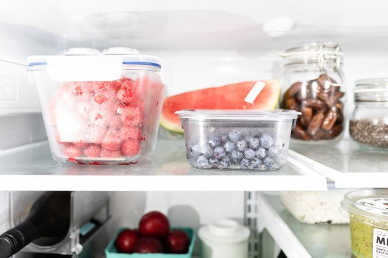 fruit in the refrigerator with glass canisters