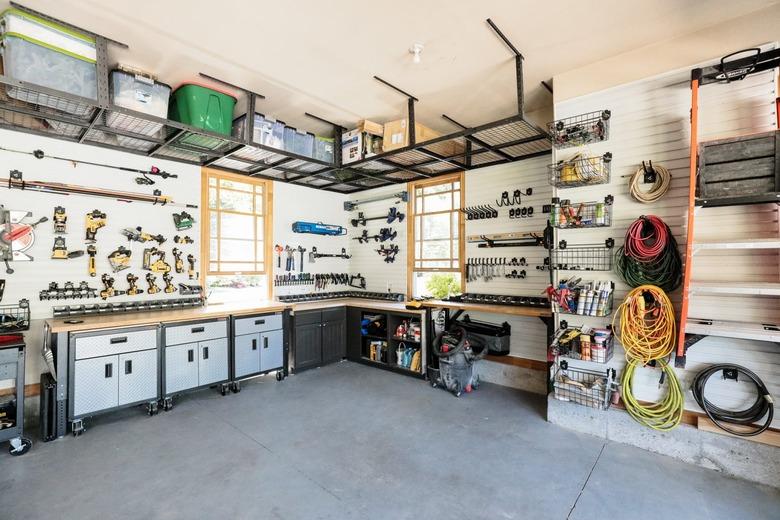 Organized garage shelving by Chris Loves Julia with Garage Wall Shelving Ideas