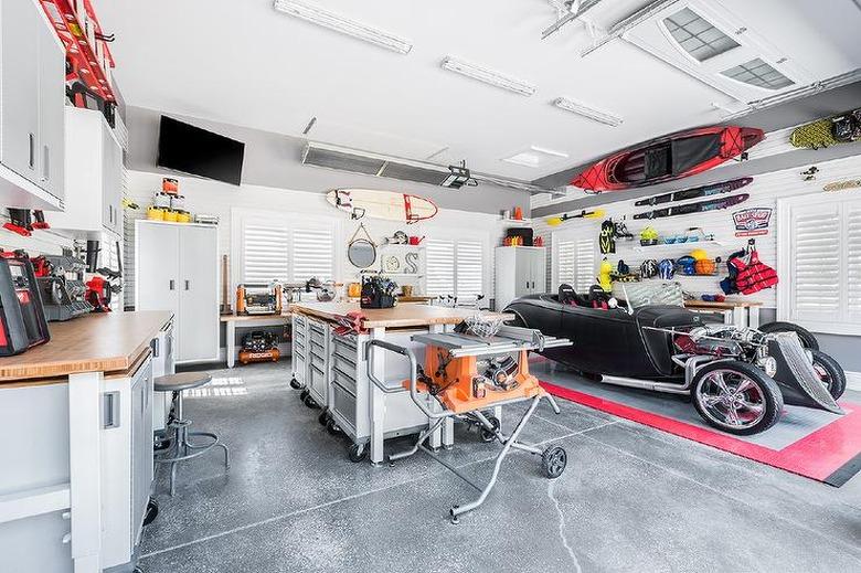 Garage work and hang out zone with Garage Wall Shelving Ideas