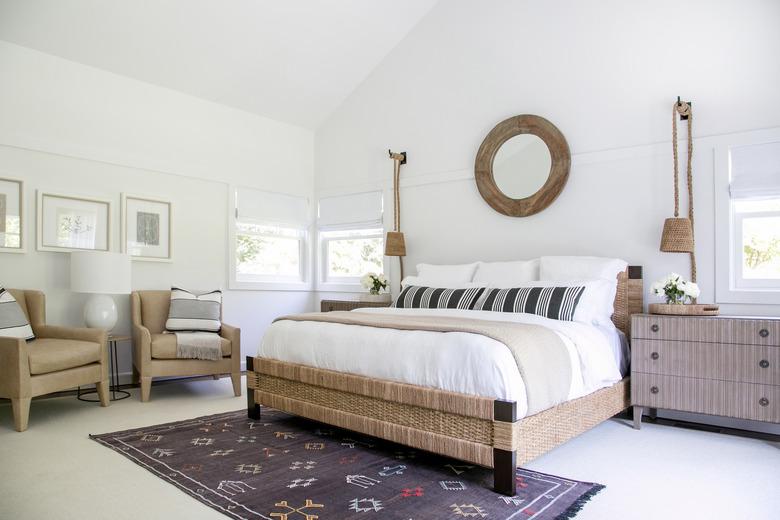 symmetrical bedroom with white walls and pendant lighting