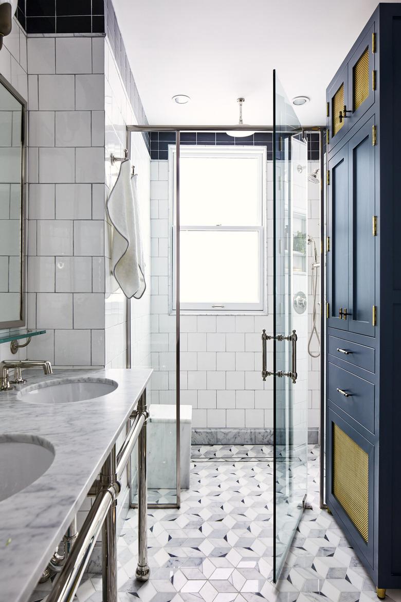 white and gray glam bathroom with semi-frameless glass shower door