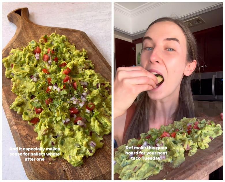 On the left is guacamole smeared on a wooden board topped with tomato, onion, and cilantro. On the right is a woman with brown hair holdup up the guacamole board and eating a chip.