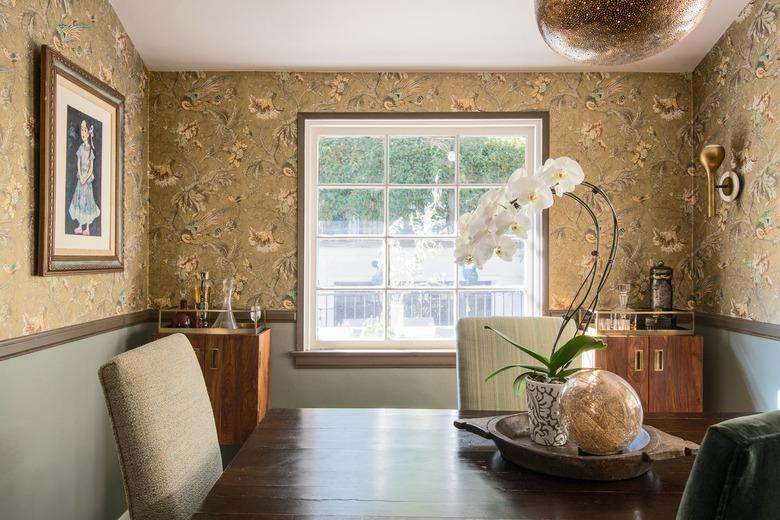 dining room wall decor idea for traditional dining room with floral wallpaper and white orchid plant