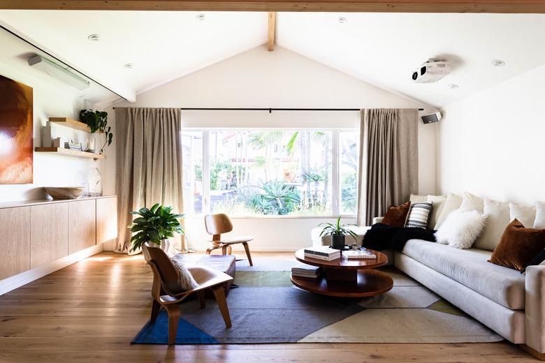 living room with hardwood flooring and area rug