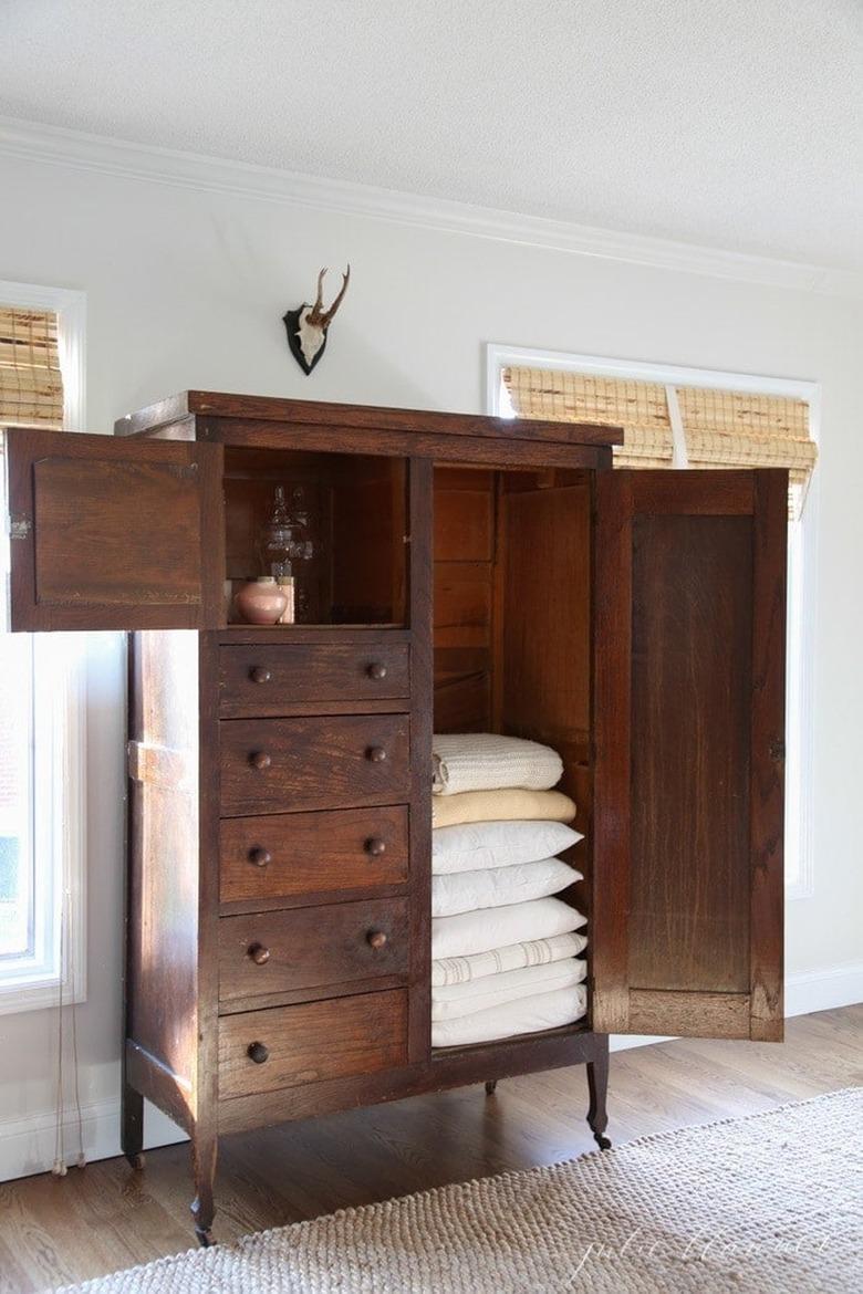 blanket storage in linen cabinet