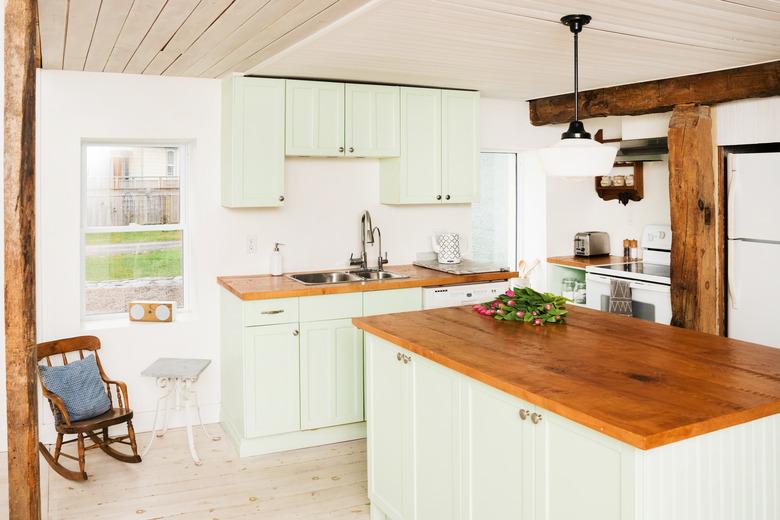 mint green cabinets, kitchen, wood countertops