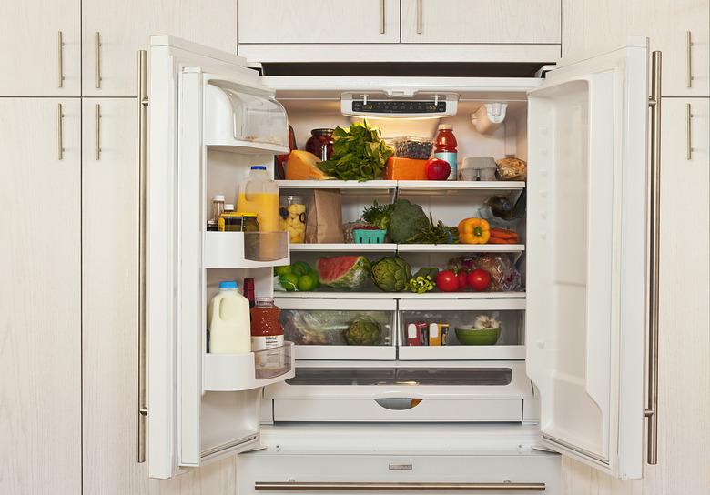 View inside refrigerator packed with healthy foods.