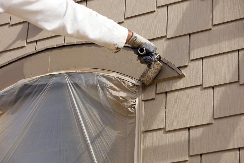 Painter Rolling Paint on Curved Window Trim