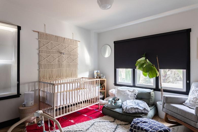 A nursery with a room darkening roller shade