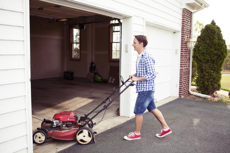 Parking lawn mower in garage.