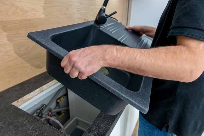 Installing a new ceramic sink in kitchen