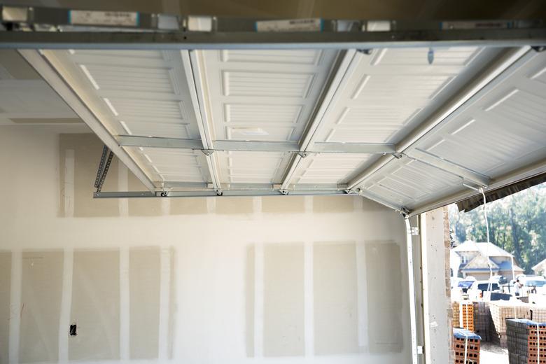 New homes construction site.  Overhead garage door.