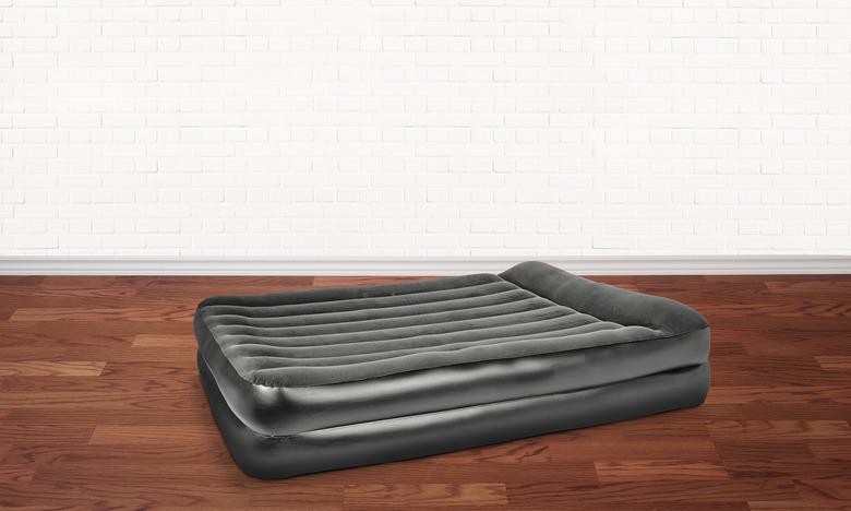 inflatable mattress in an empty room