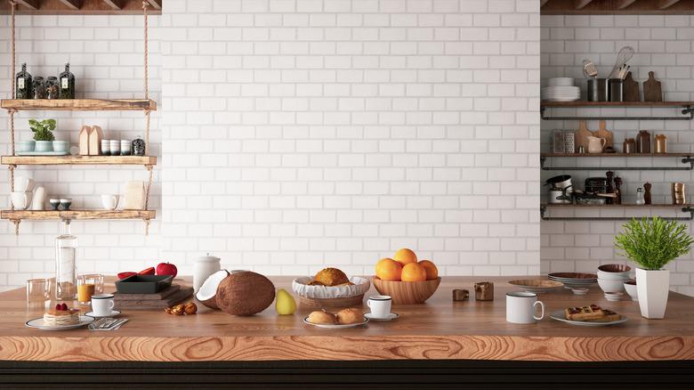 Kitchen Counter with Foods and Empty White Brick Wall