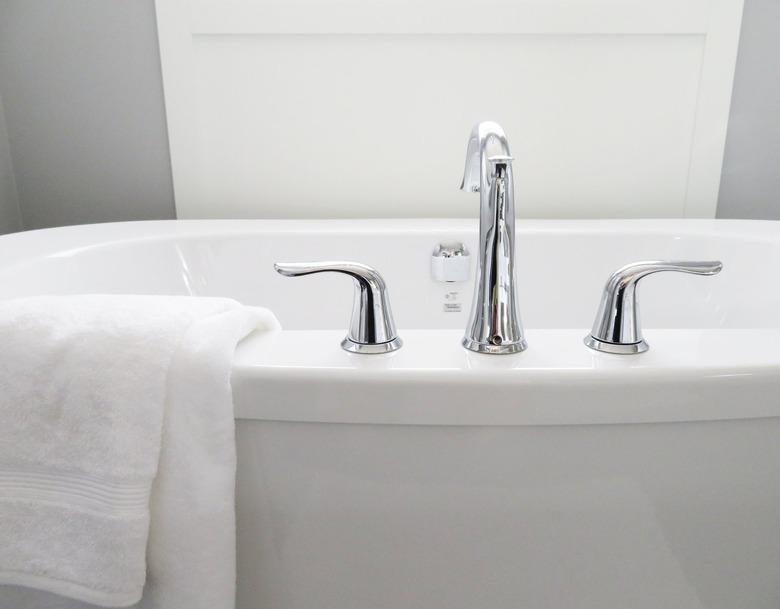 White bathtub with a white towel