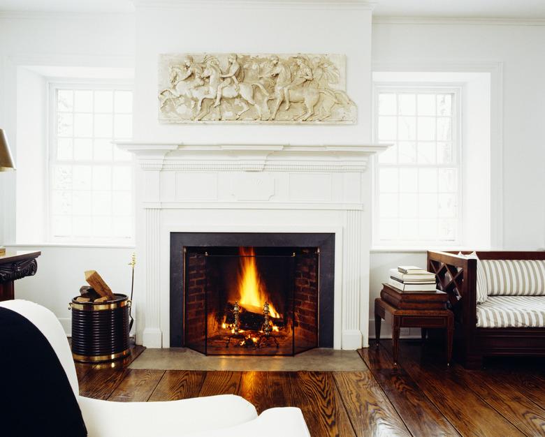 Front view of fire lit in living room fireplace