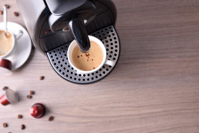 Expresso coffee machine on wood table top view