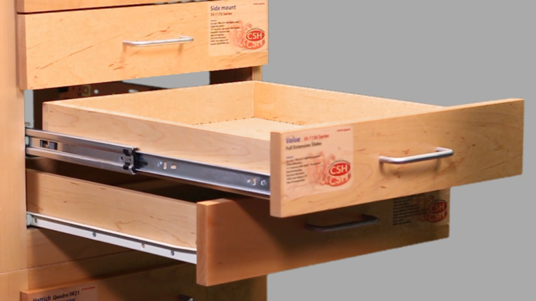 Side mount drawer glides.