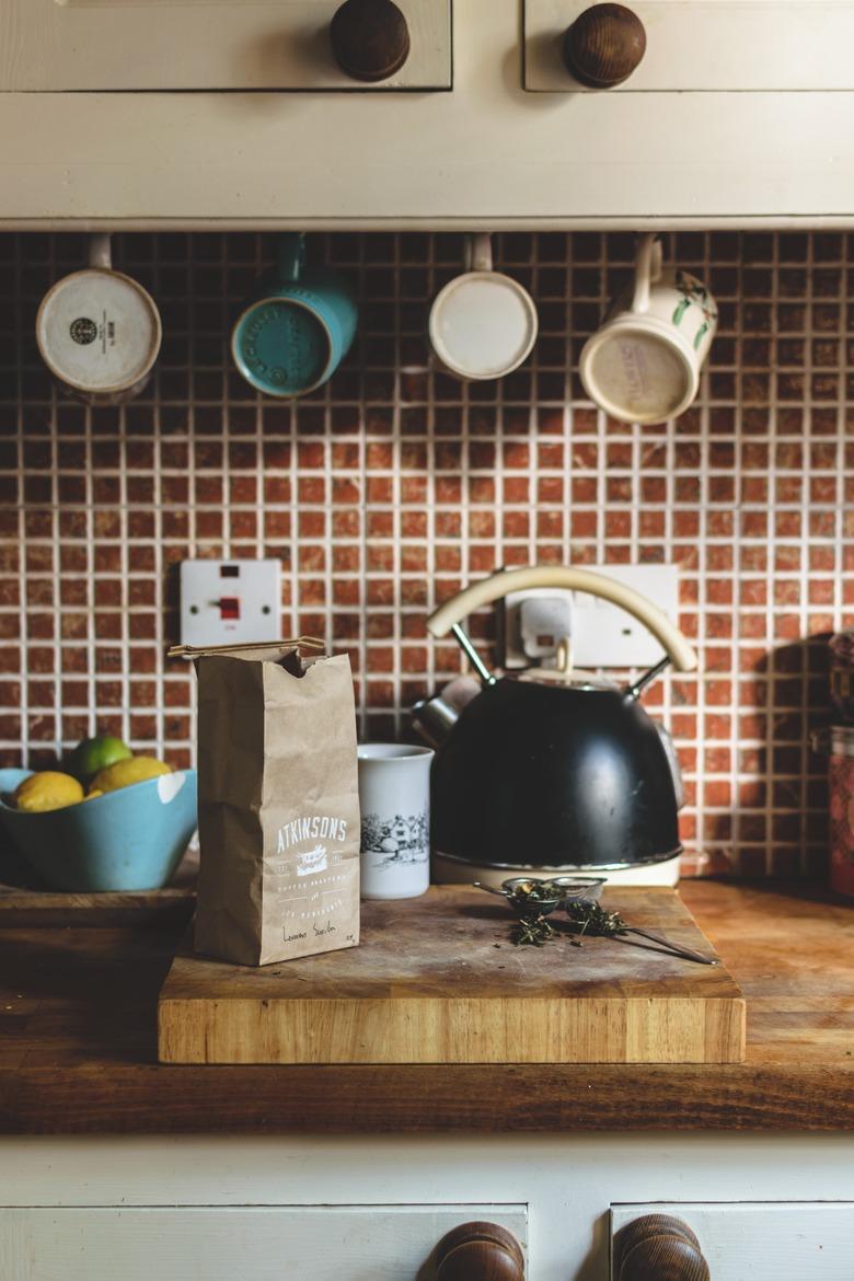 Clean tiled kitchen backsplash.