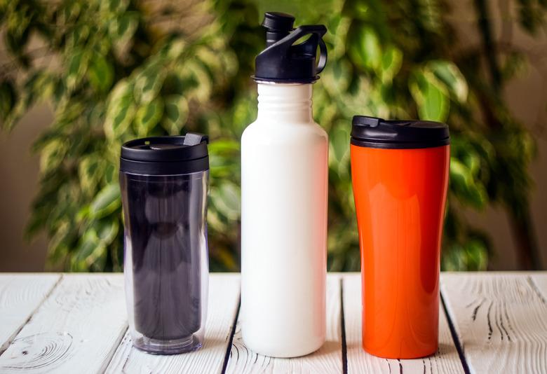 Reusable water bottles on table.