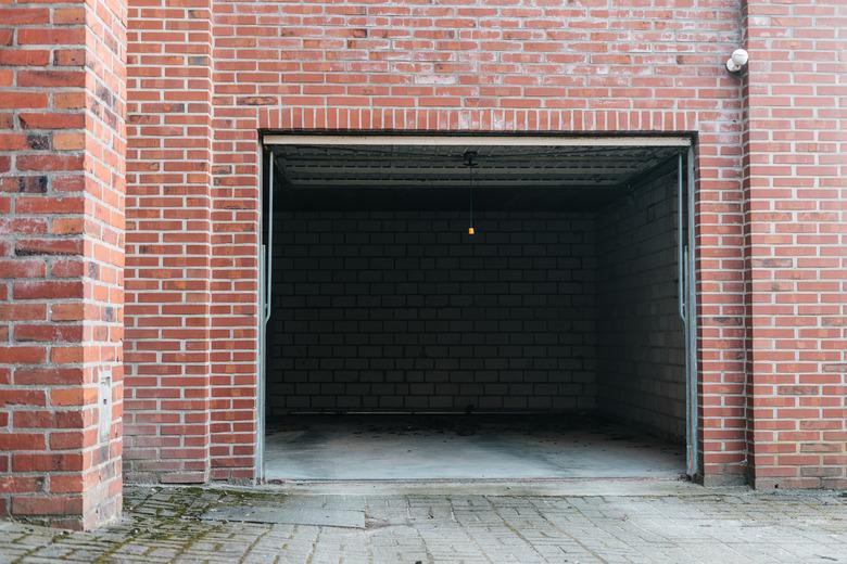 Open garage with beautiful red brick