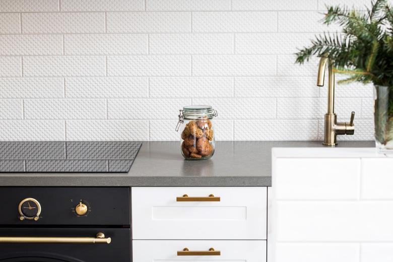 Cookies In Glass Jar On Kitchen Counter Against Wall At Home