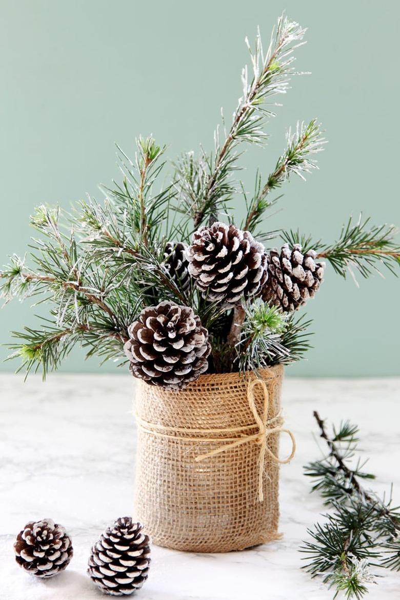 pine cone in vase made out of a can for a centerpiece decoration