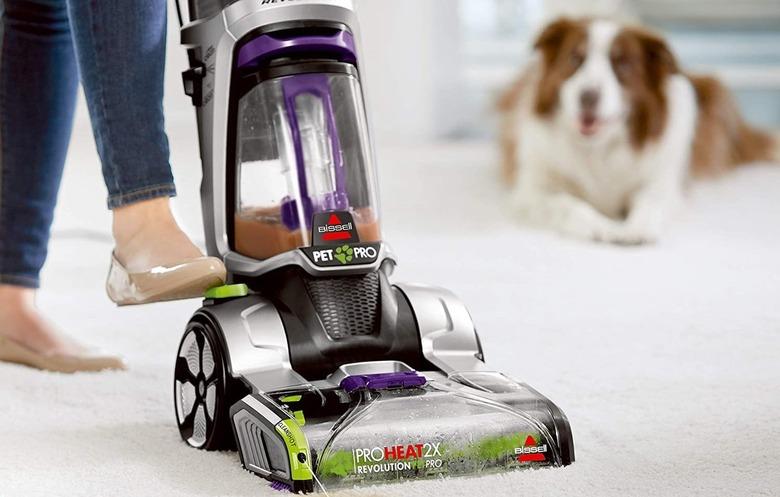 Steam cleaning a carpet.