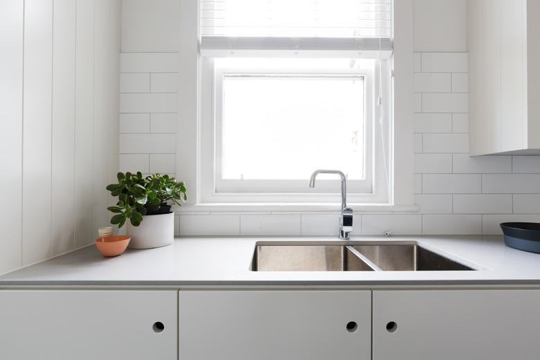 Close up details of contemporary white apartment kitchen