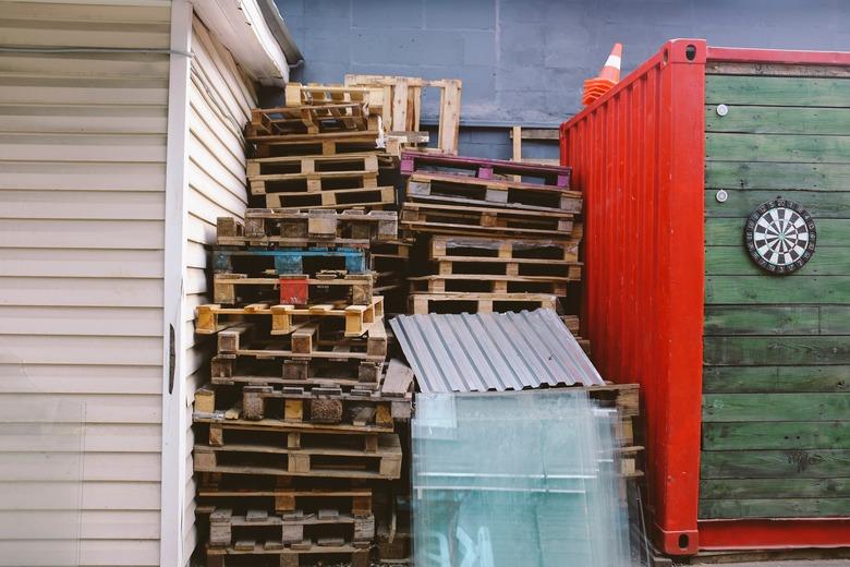 Pallets stacked for recycling.