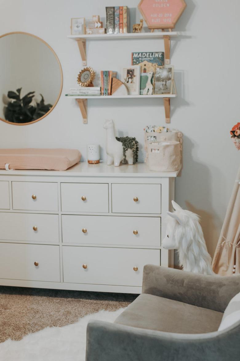 Nursery idea with IKEA dresser and shelving above