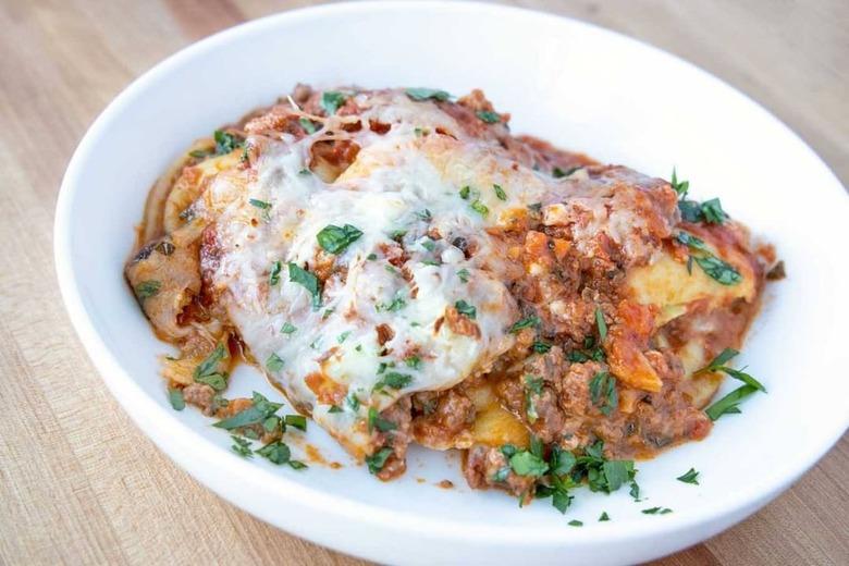 plate of raviolo lasagna with impossible meat bolognese