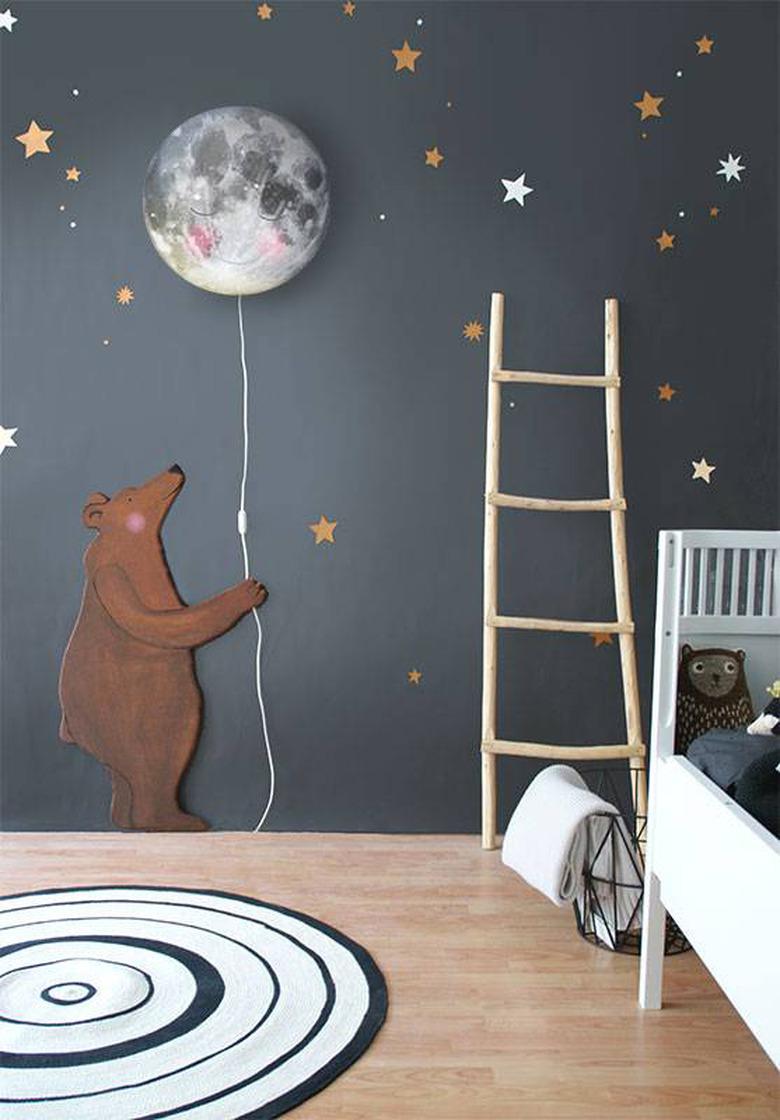 kids' bedroom idea with black walls and stars and bear holding a moon balloon