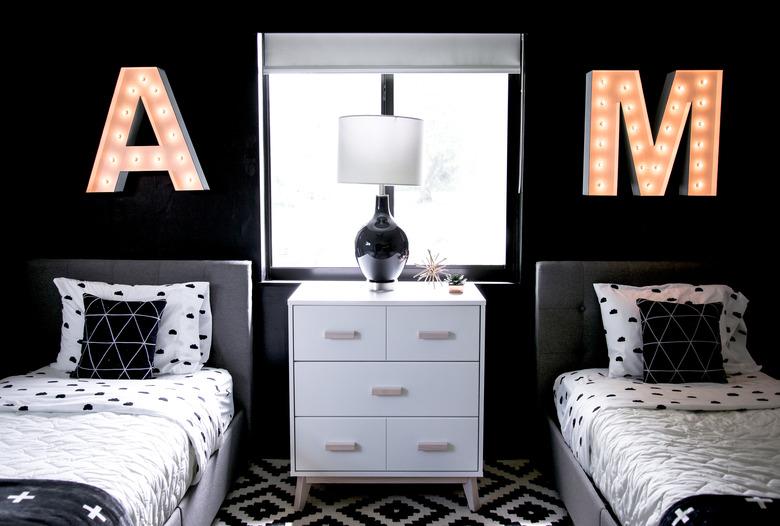 black gender neutral shared kids bedroom idea with neon lights