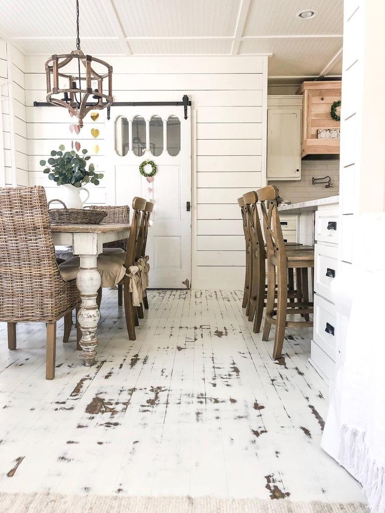 farmhouse space with white distressed kitchen floor paint