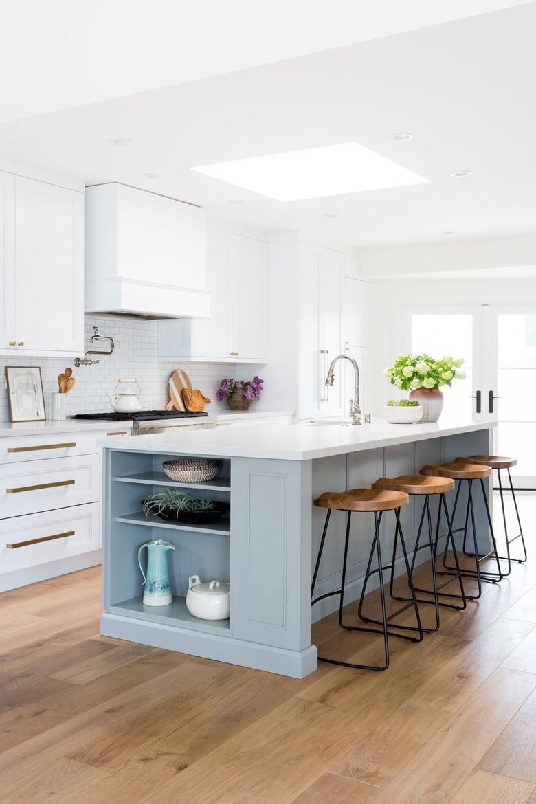 traditional kitchen island ideas with seating and white range hood