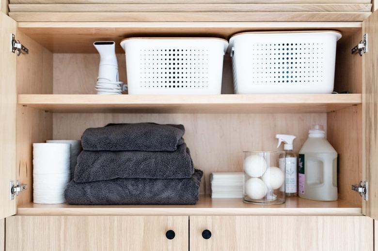 laundry room idea with storage in cabinet