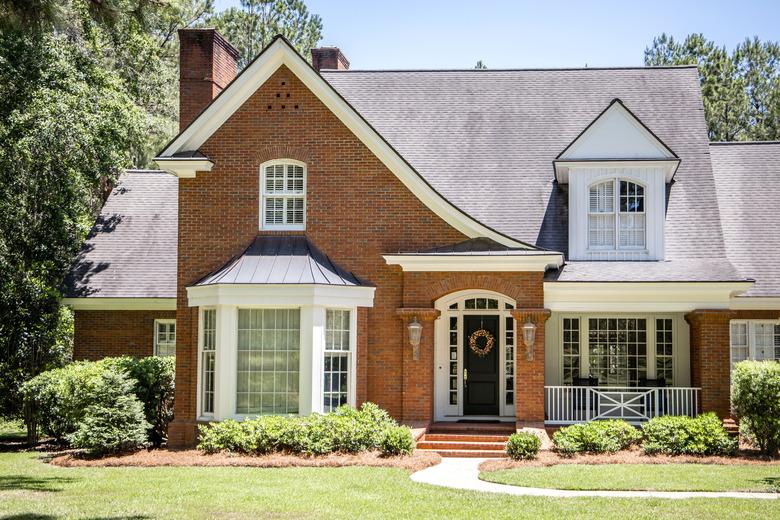 Front view of Exterior of Red Brick Traditional Southern Home