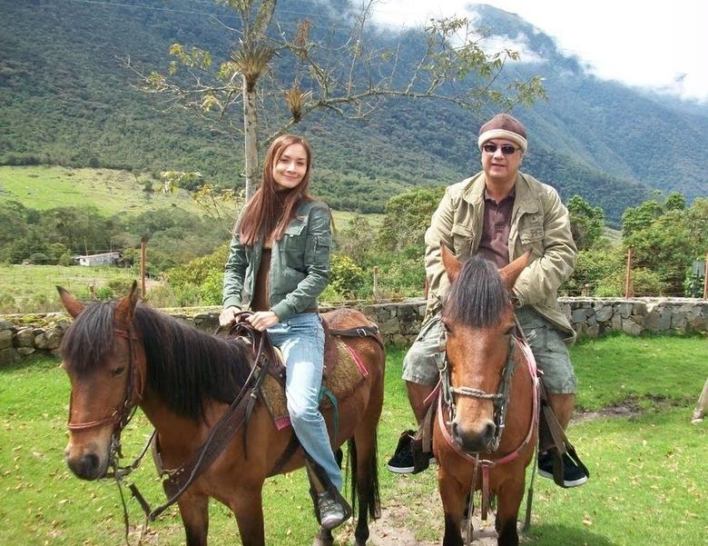 woman and her dad riding horses together