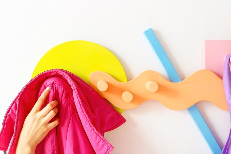 A squiggly orange coat rack designed by Sophie Collé.