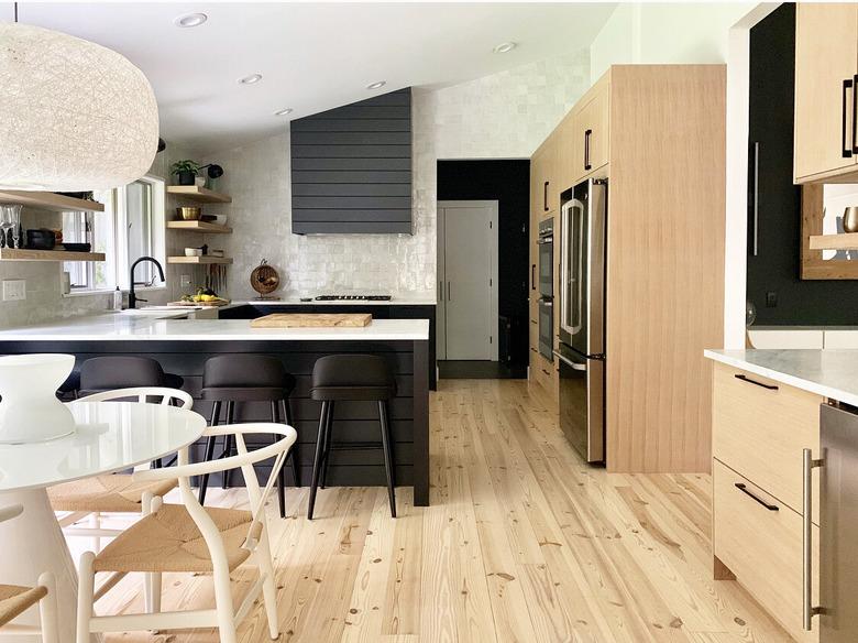 light wood kitchen floors and wood cabinets by Dichotomy Interiors